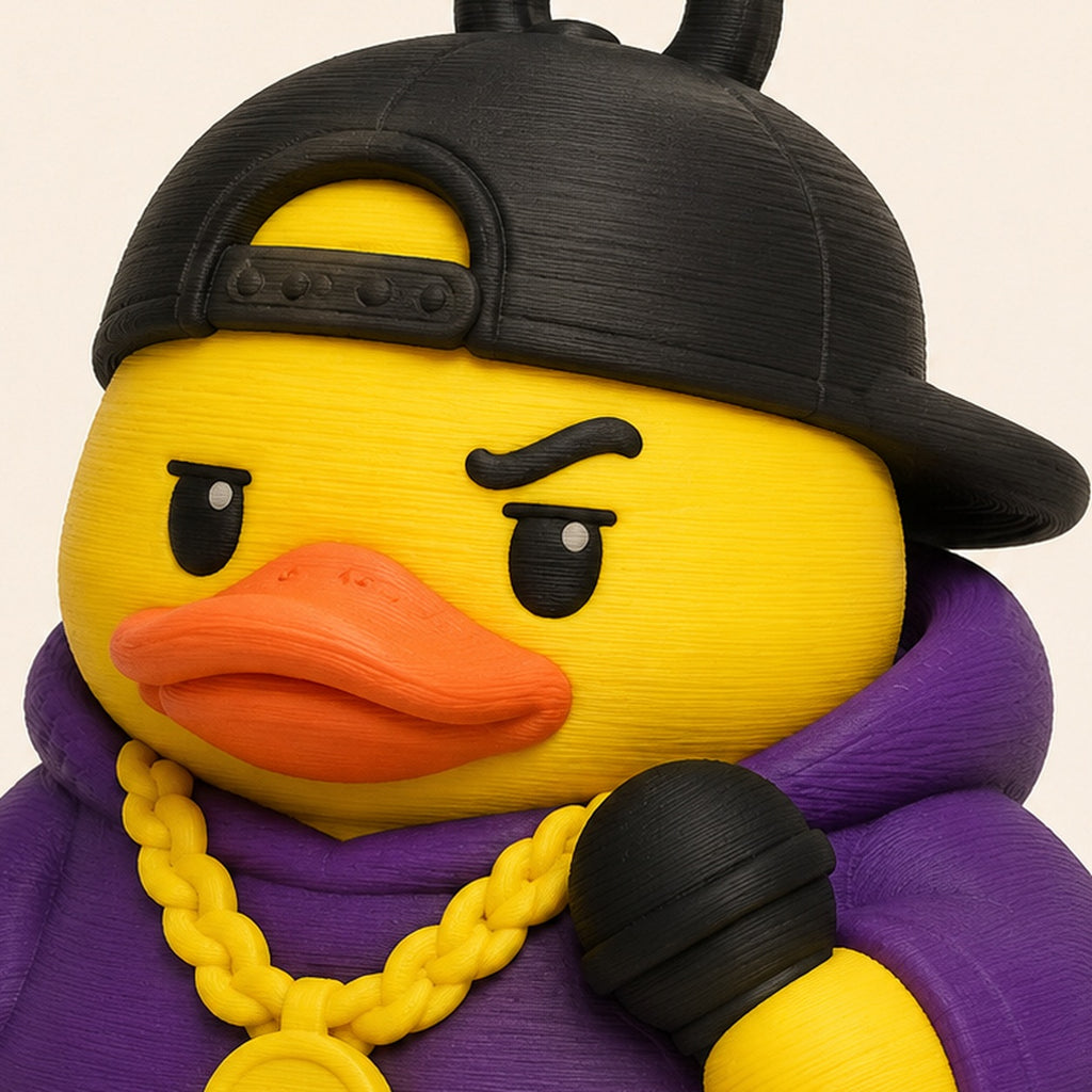 Rap Duck close-up – cap, angry eyes, gold chain and microphone detail